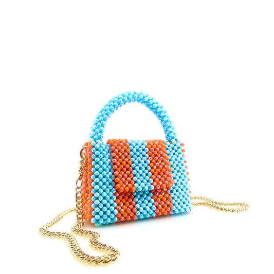 blue and orange stripe beaded handbag with gold chain. on white background