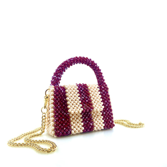 burgundy and cream stripe beaded handbag with gold chain. on white background