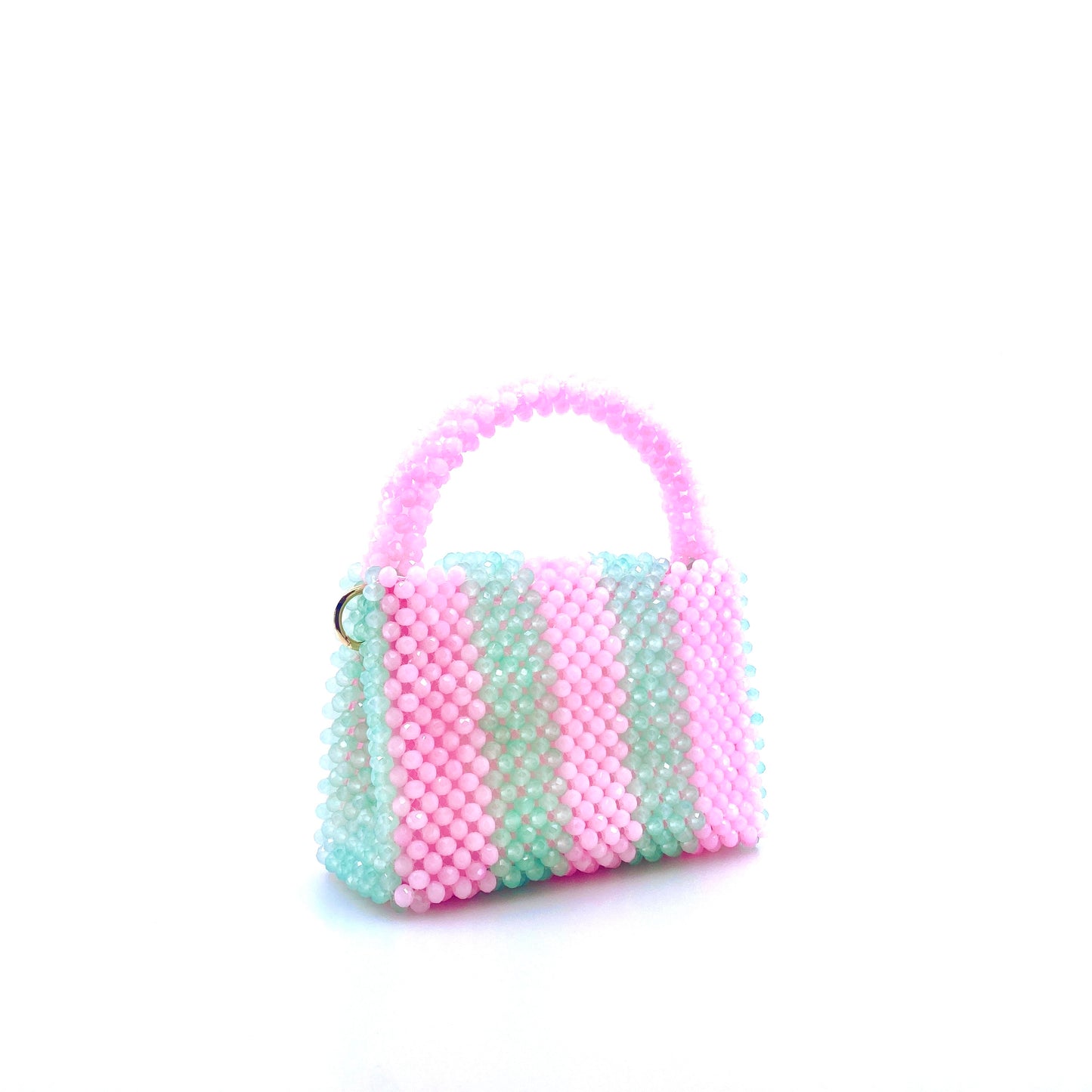 green and pink stripe beaded handbag. on white background