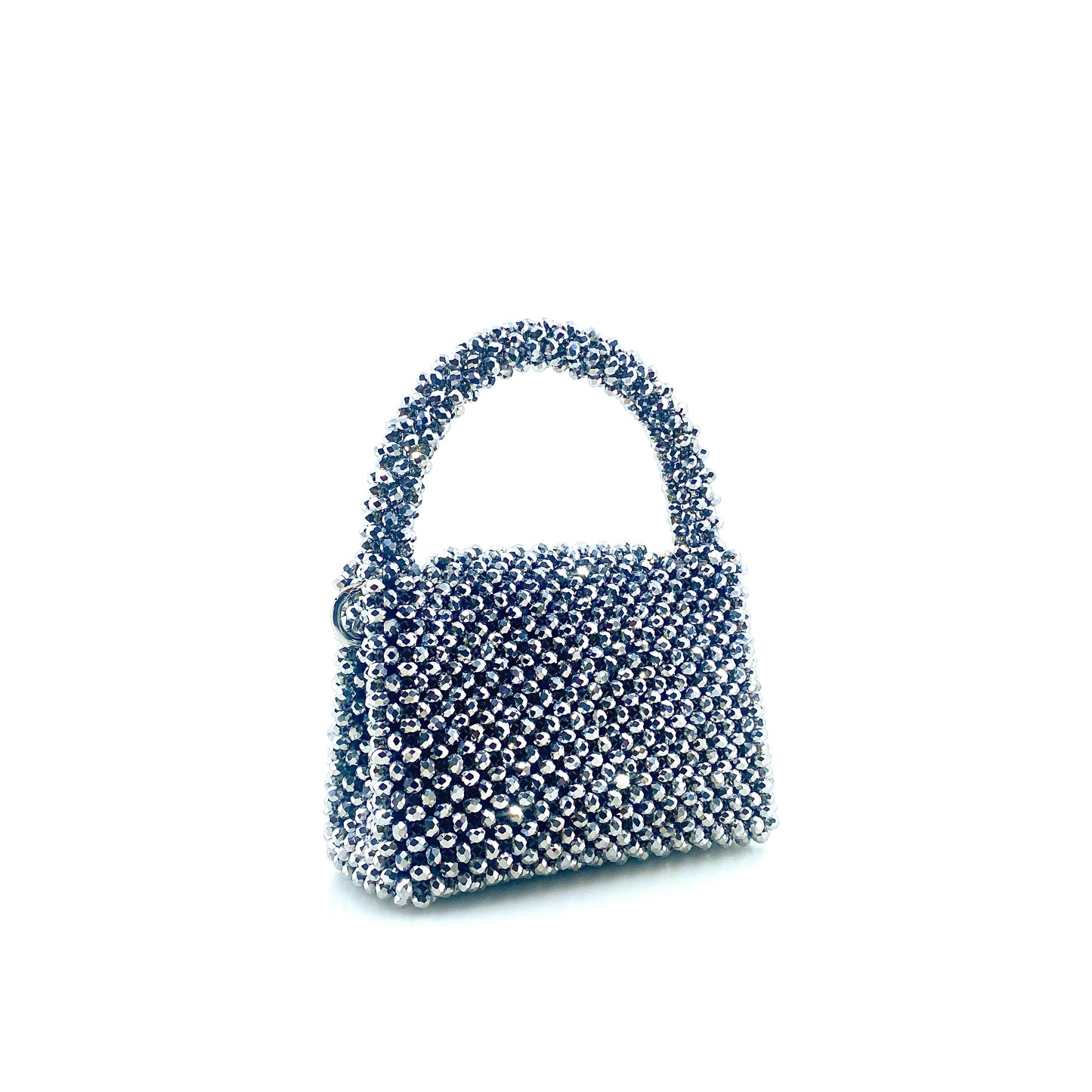 silver beaded handbag on white background