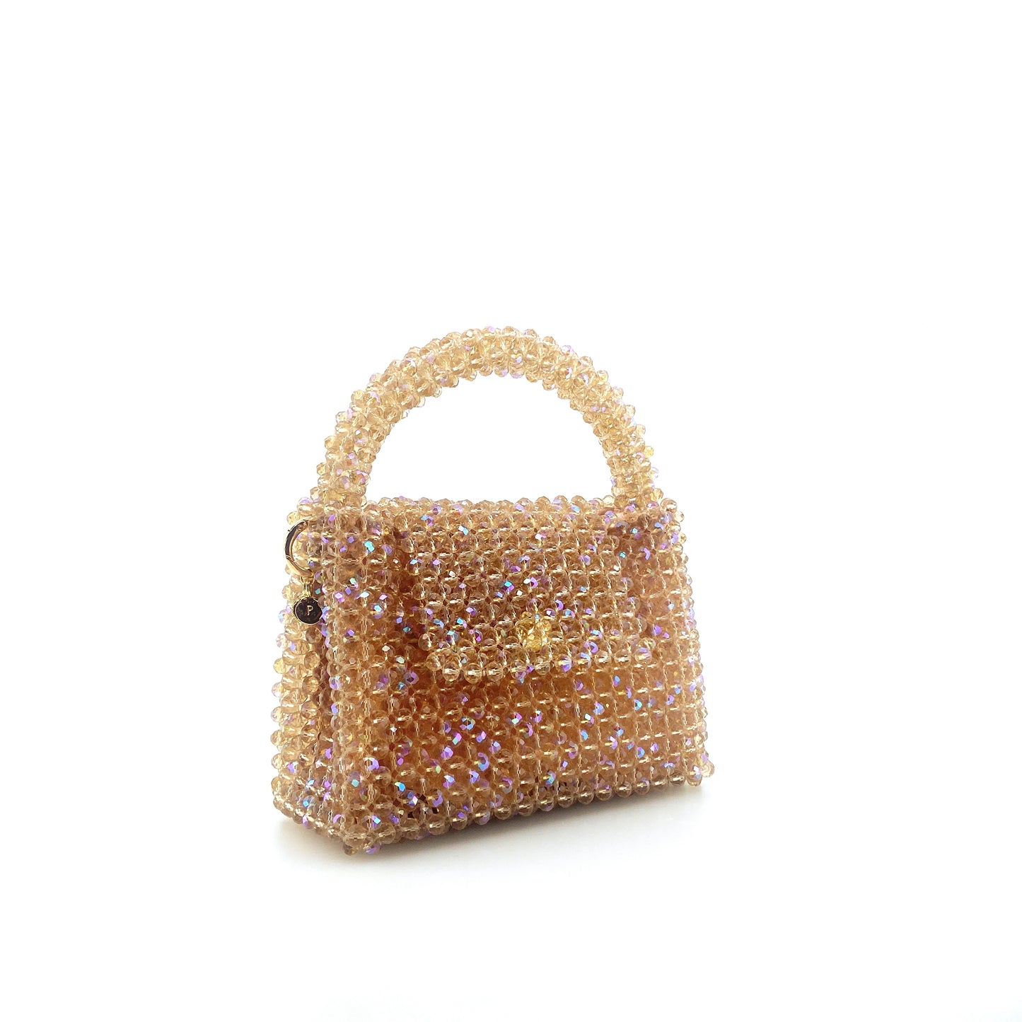 beige beaded handbag. on white background