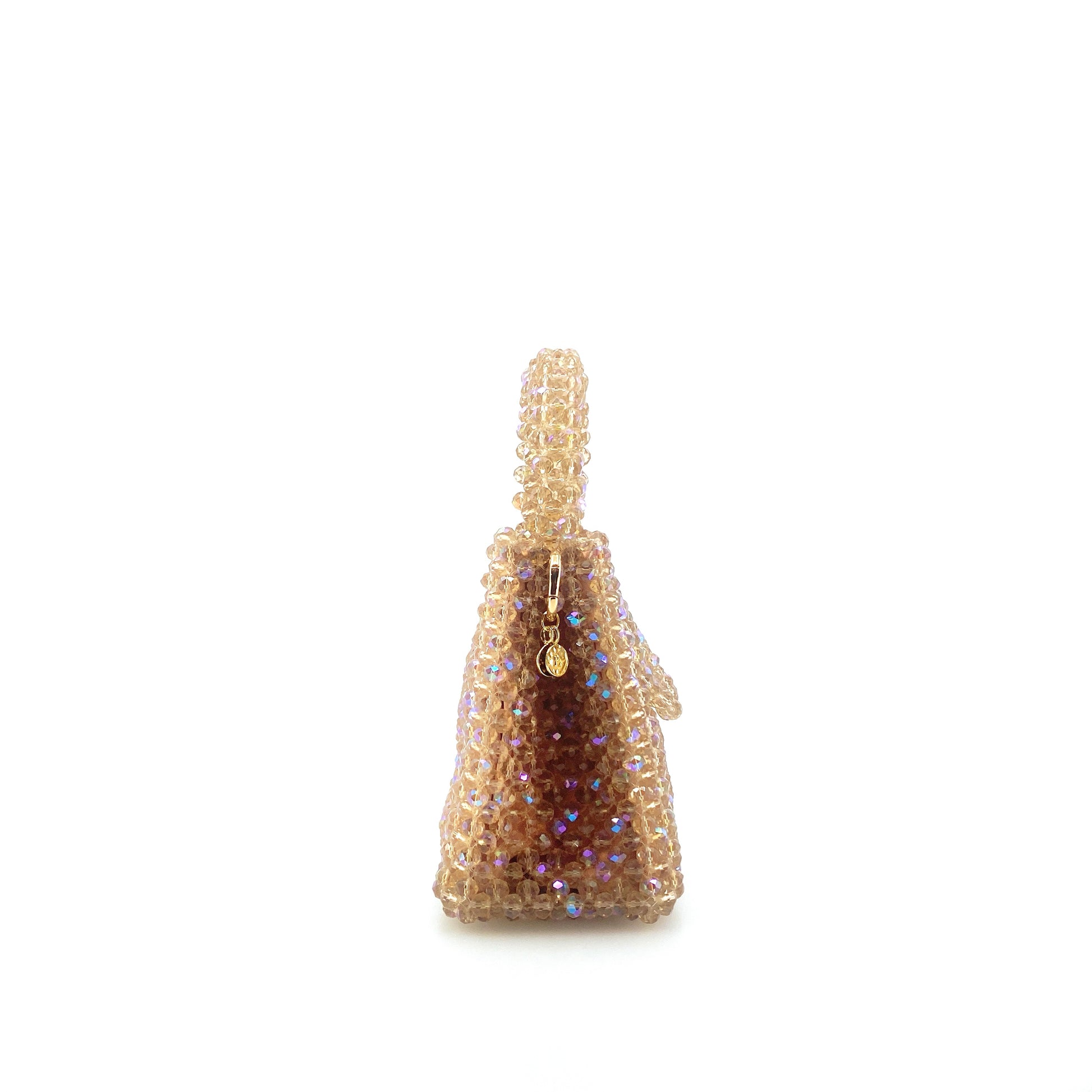 beige beaded handbag. on white background
