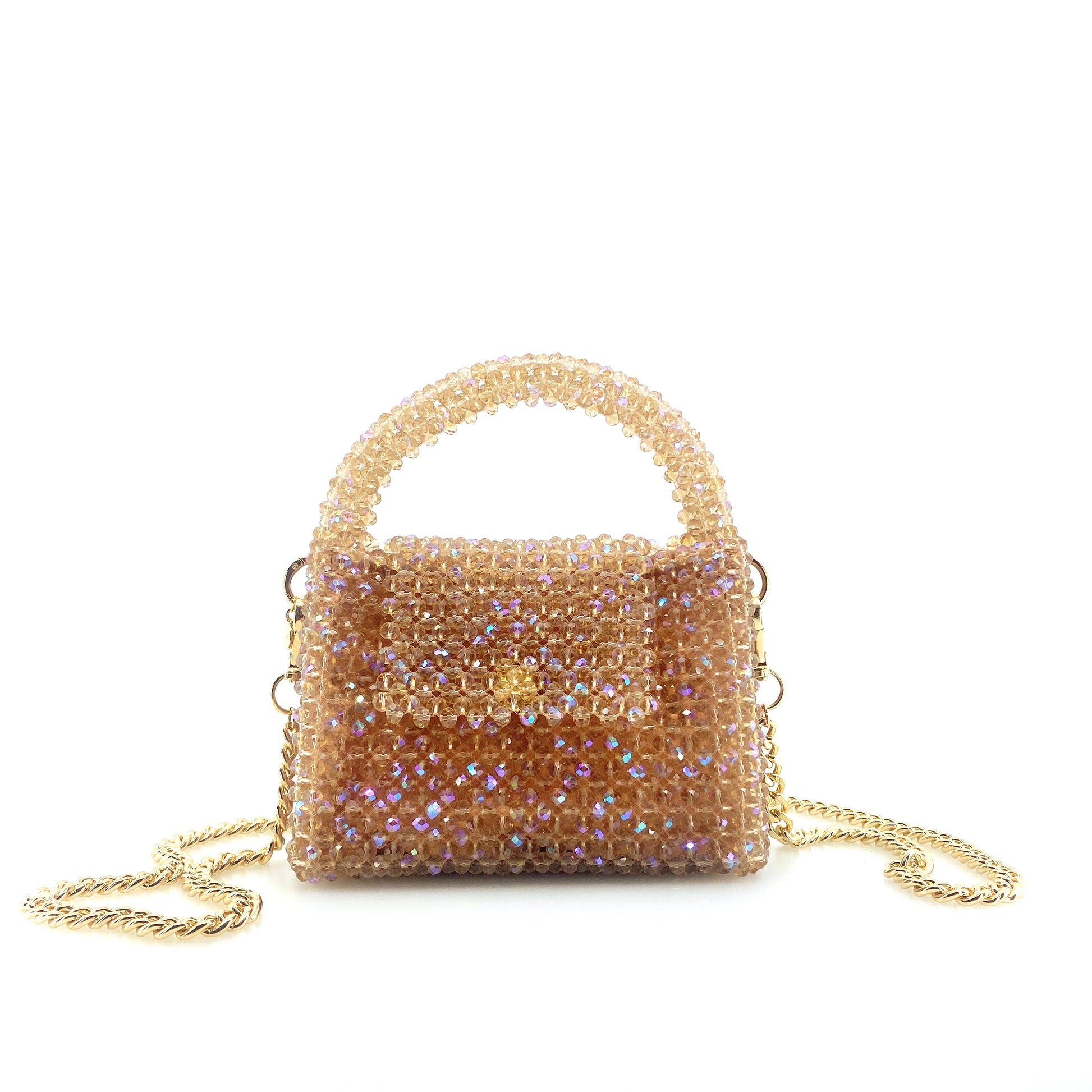 beige beaded handbag with gold chain. on white background