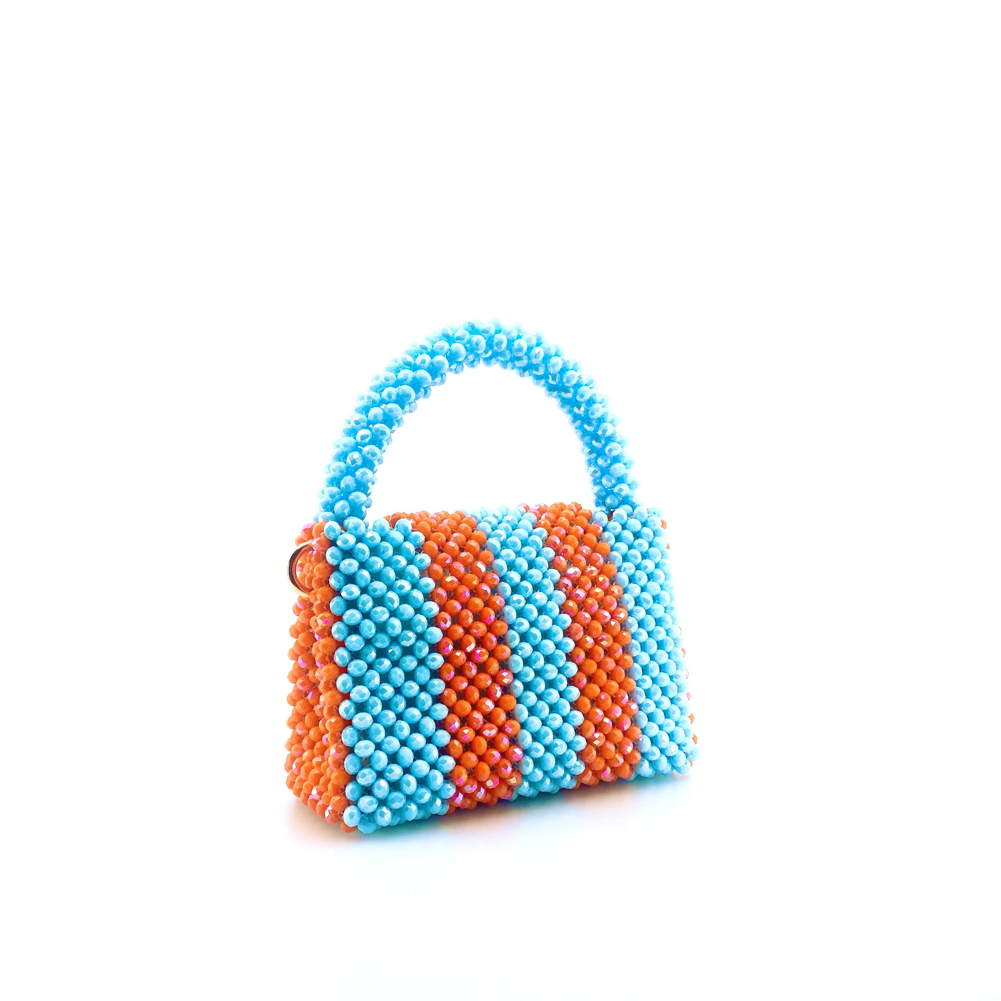 blue and orange stripe beaded handbag. on white background