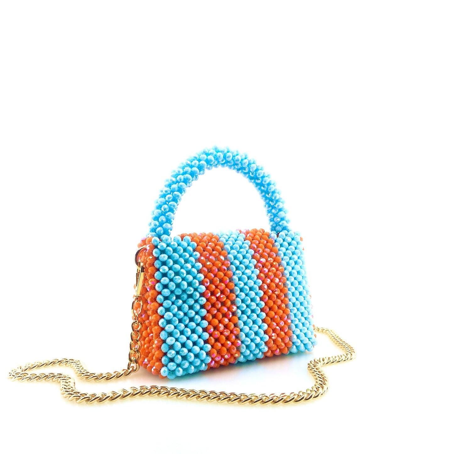 blue and orange stripe beaded handbag with gold chain. on white background