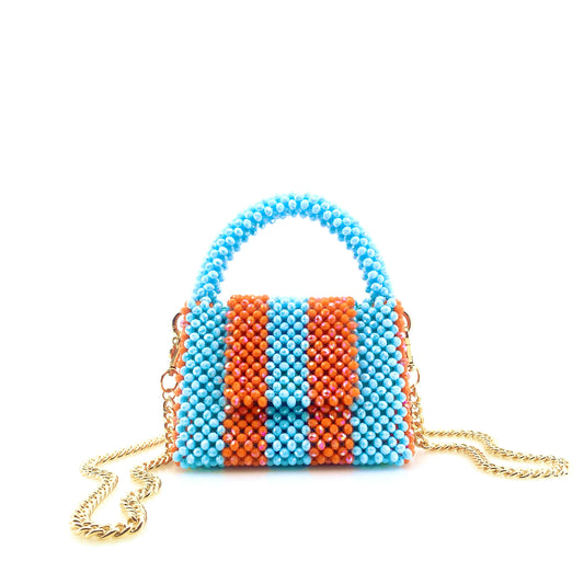 blue and orange stripe beaded handbag with gold chain. on white background