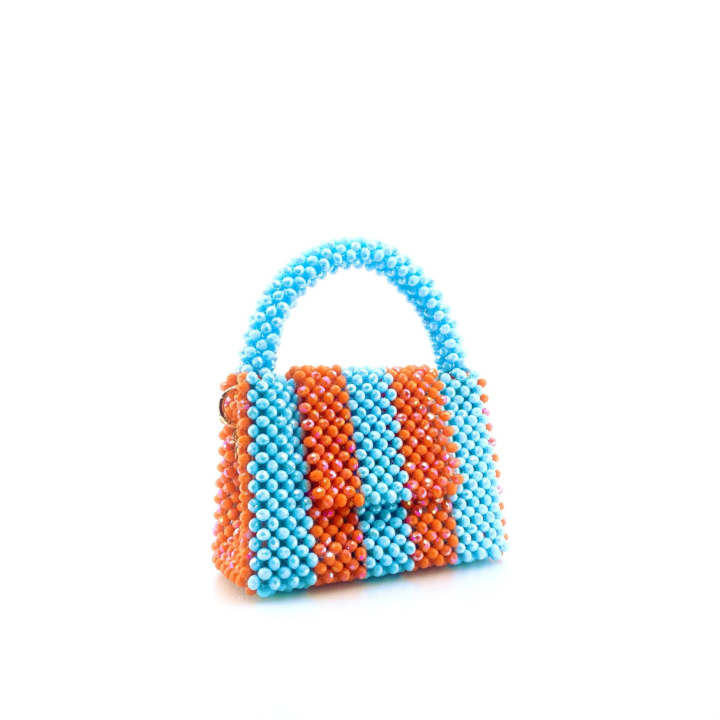 blue and orange stripe beaded handbag. on white background