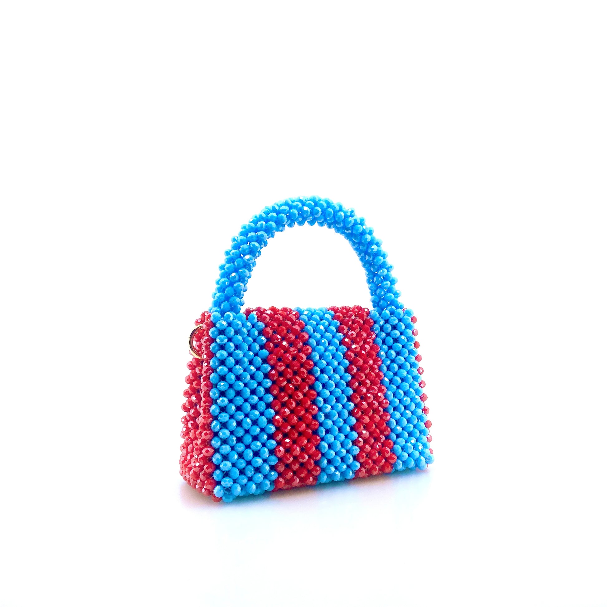 blue and red stripe beaded handbag. on white background