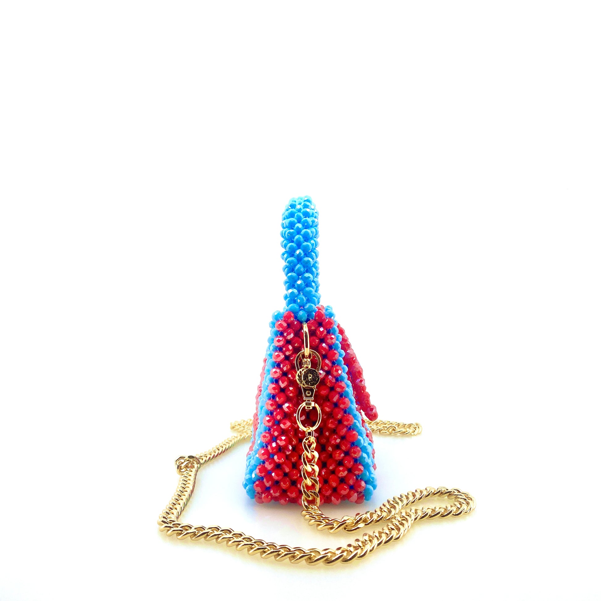 blue and red stripe beaded handbag with gold chain. on white background
