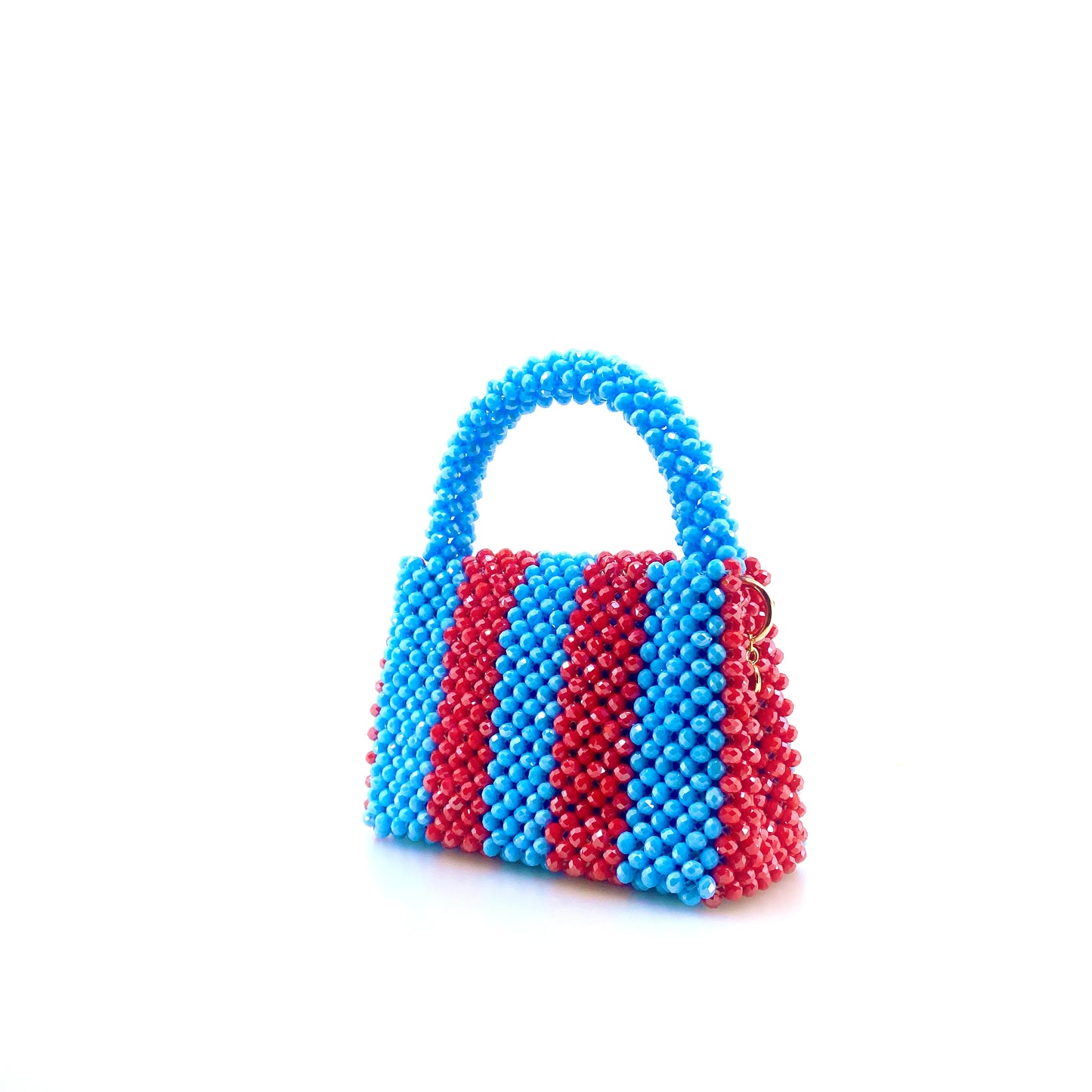 blue and red stripe beaded handbag. on white background