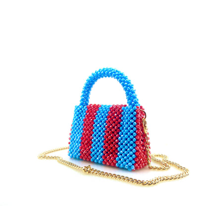 blue and red stripe beaded handbag with gold chain. on white background