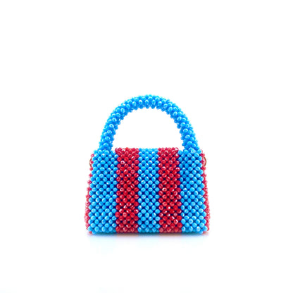 blue and red stripe beaded handbag. on white background