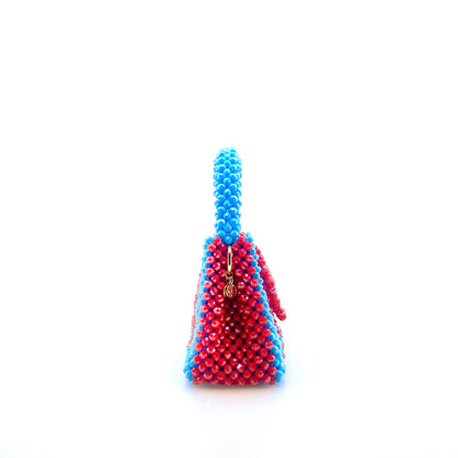 blue and red stripe beaded handbag. on white background