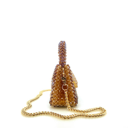 brown and beige stripe beaded handbag with gold chain. on white background
