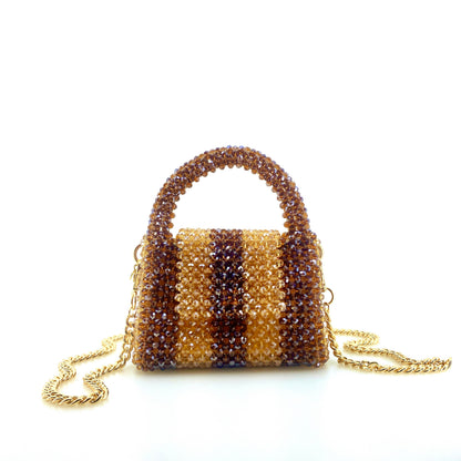 brown and beige stripe beaded handbag with gold chain. on white background