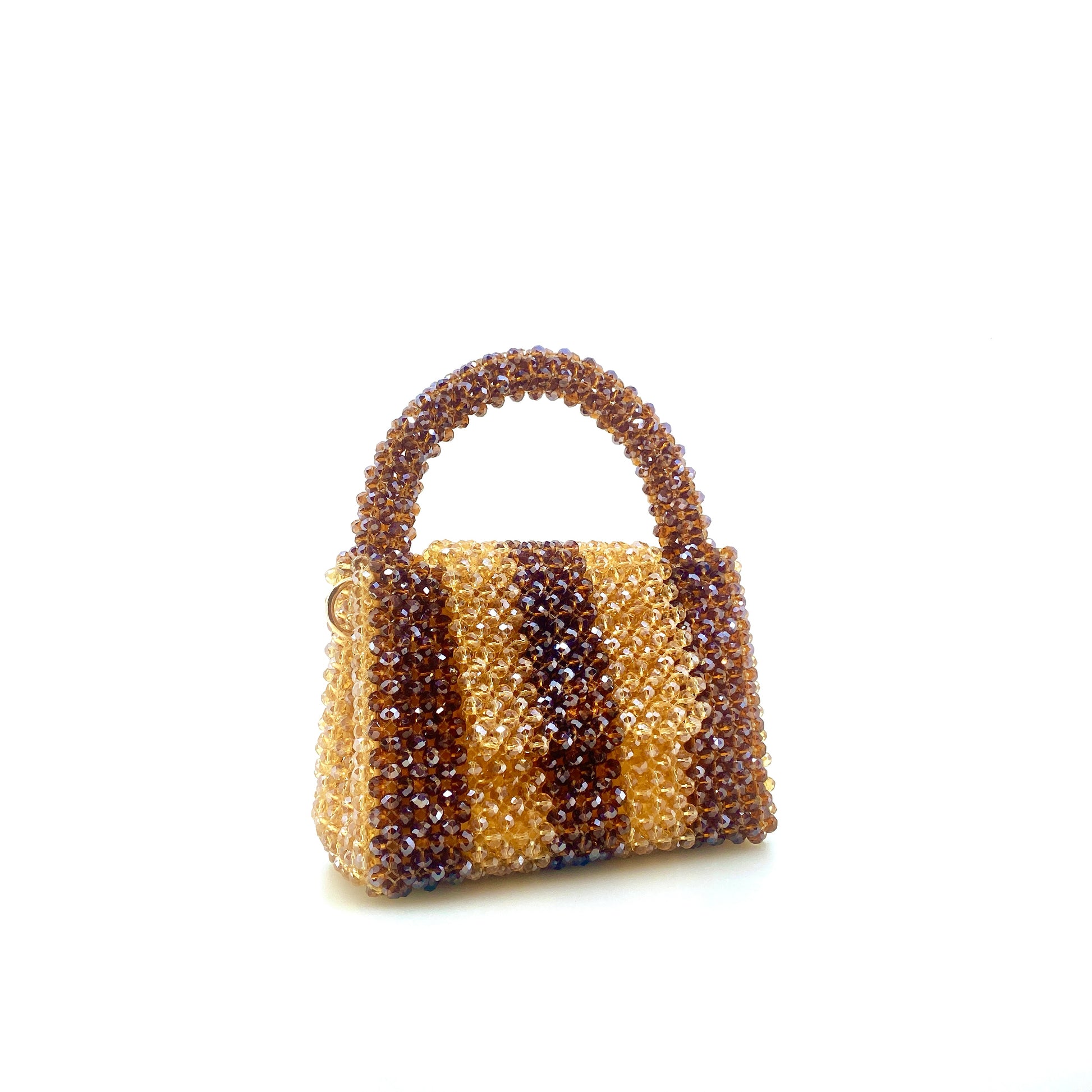 brown and beige stripe beaded bag. on white background