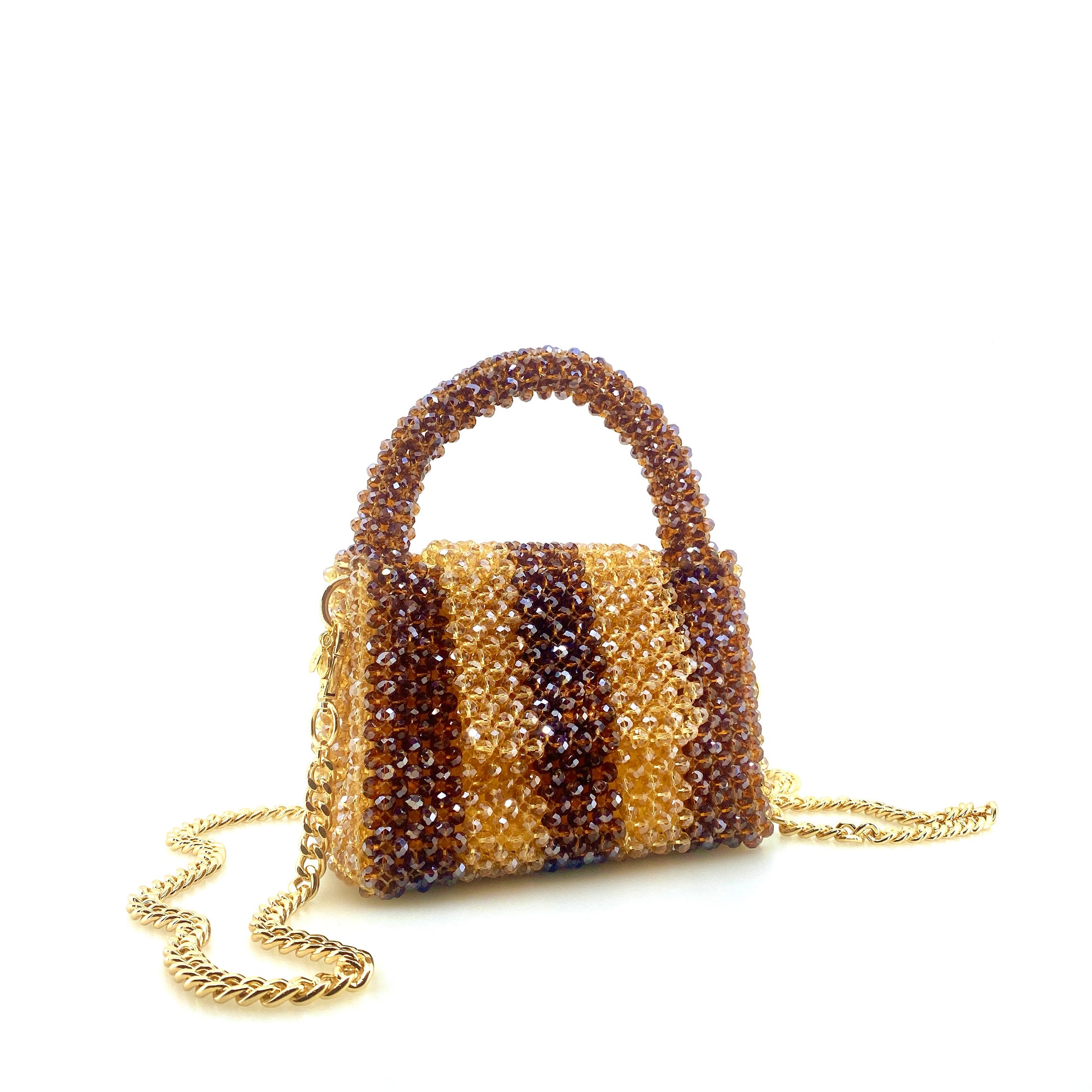 brown and beige stripe beaded handbag with gold chain. on white background