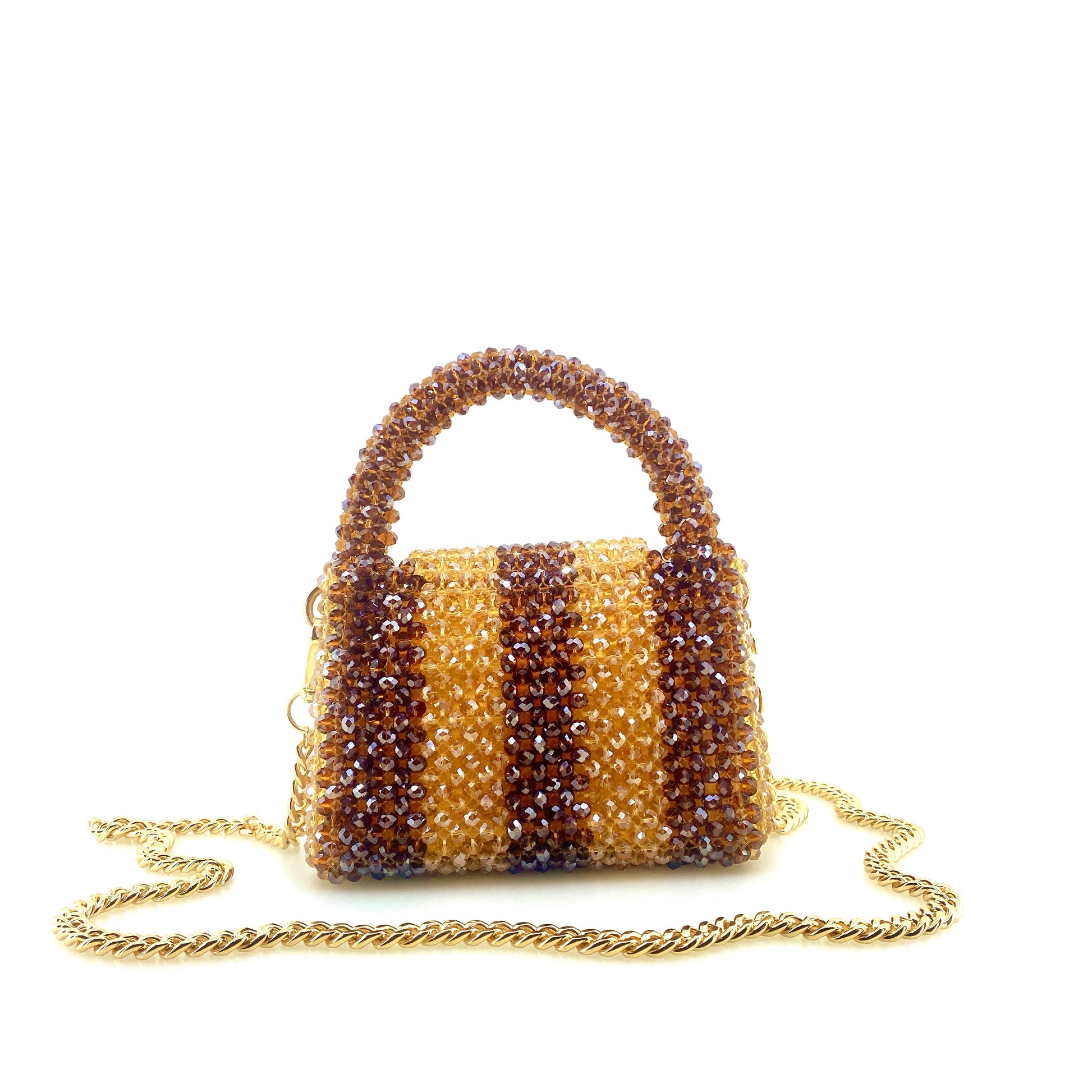 brown and beige stripe beaded handbag with gold chain. on white background