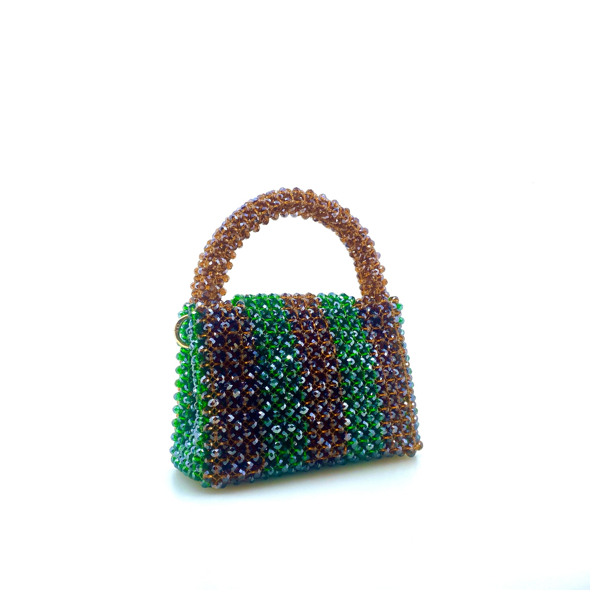 brown and green stripe beaded handbag. on white background