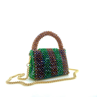 brown and green stripe beaded handbag with gold chain. on white background