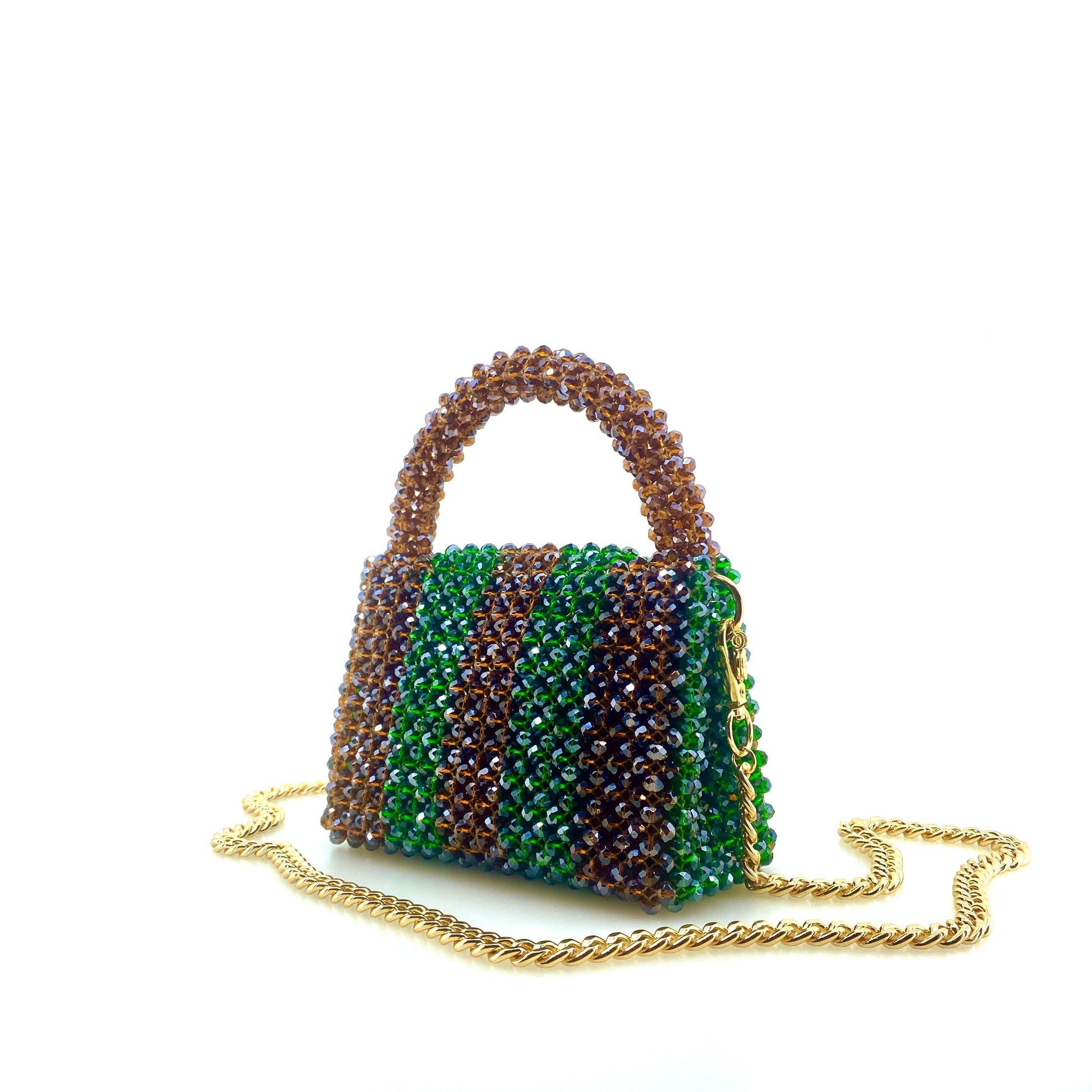 brown and green stripe beaded handbag with gold chain. on white background