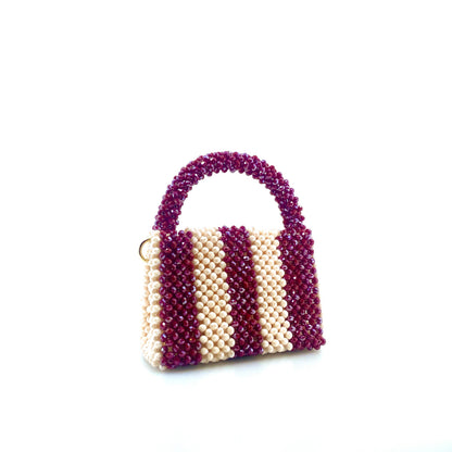 burgundy and cream stripe beaded handbag. on white background