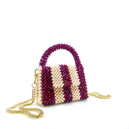 burgundy and cream stripe beaded handbag with gold chain. on white background