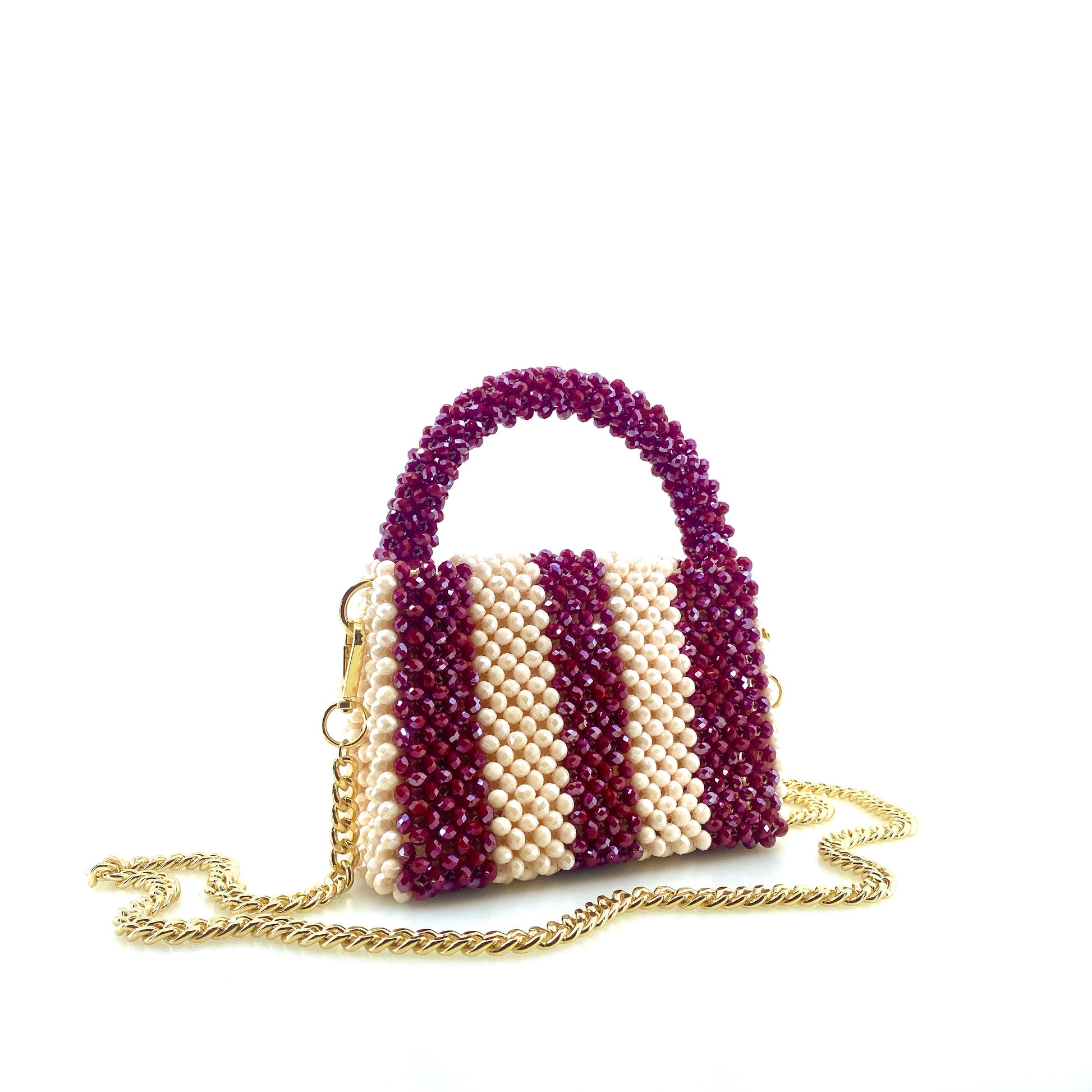 burgundy and cream stripe beaded handbag with gold chain. on white background
