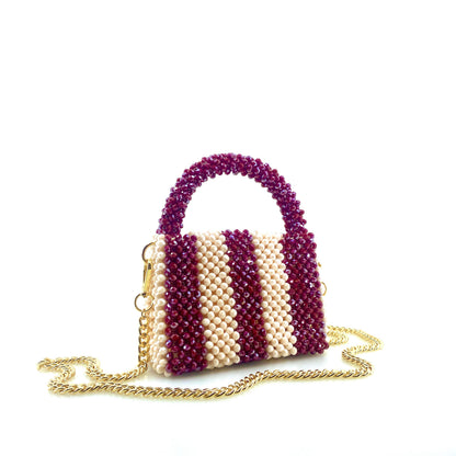 burgundy and cream stripe beaded handbag with gold chain. on white background