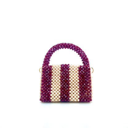 burgundy and cream stripe beaded handbag. on white background