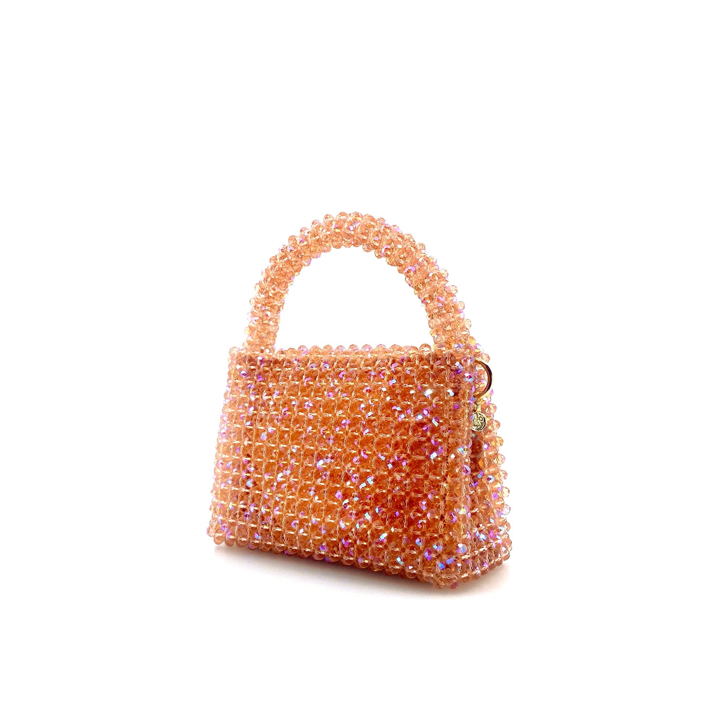 coral pink beaded handbag. on white background 
