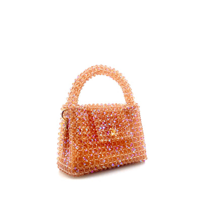 coral pink beaded handbag. on white background 