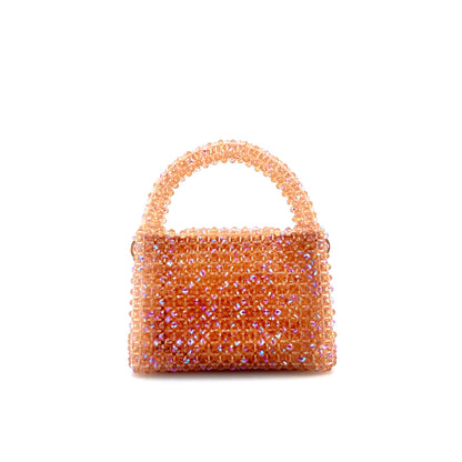 coral pink beaded handbag. on white background 