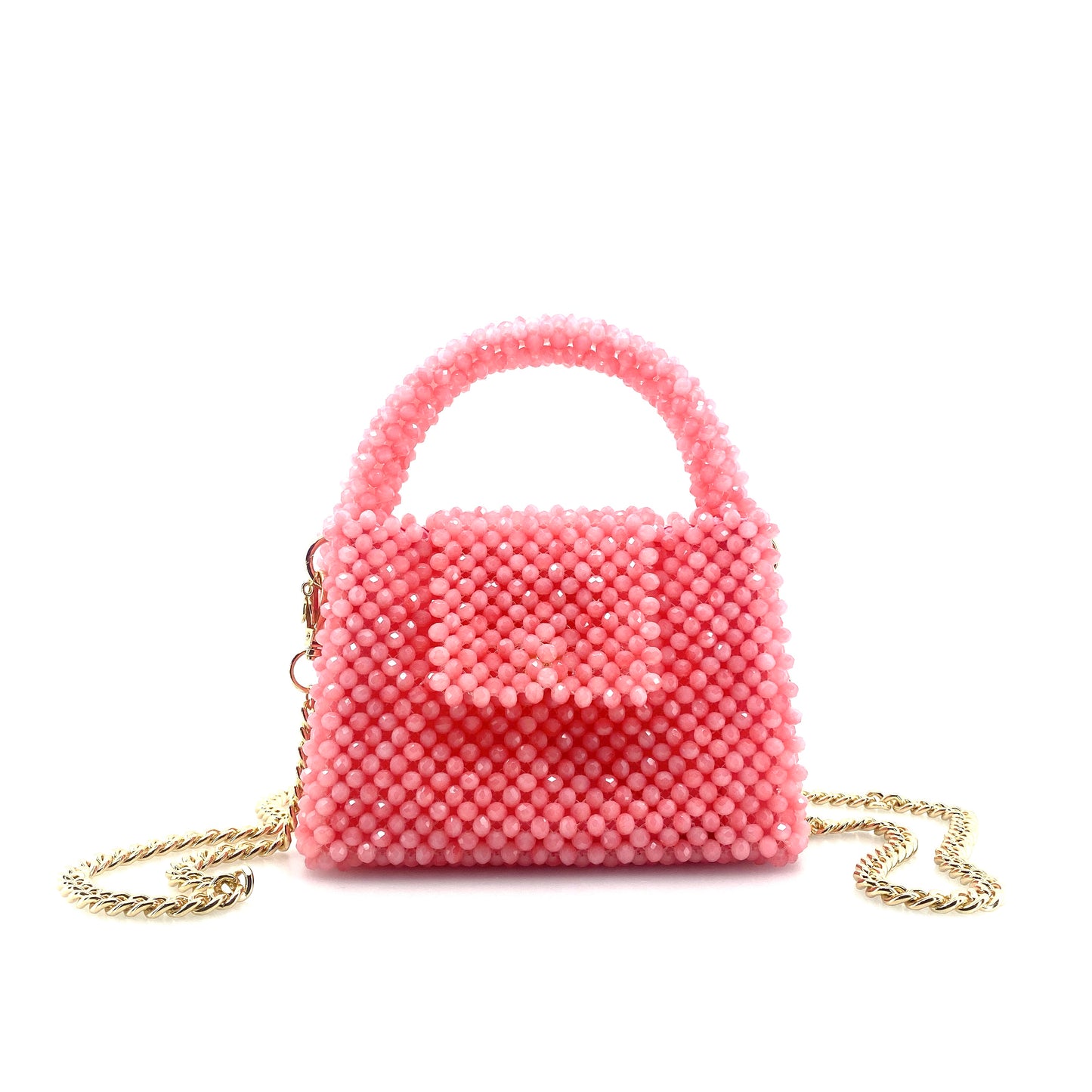 pink beaded handbag with gold chain. on white background