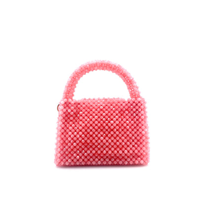 pink beaded handbag. on white background 