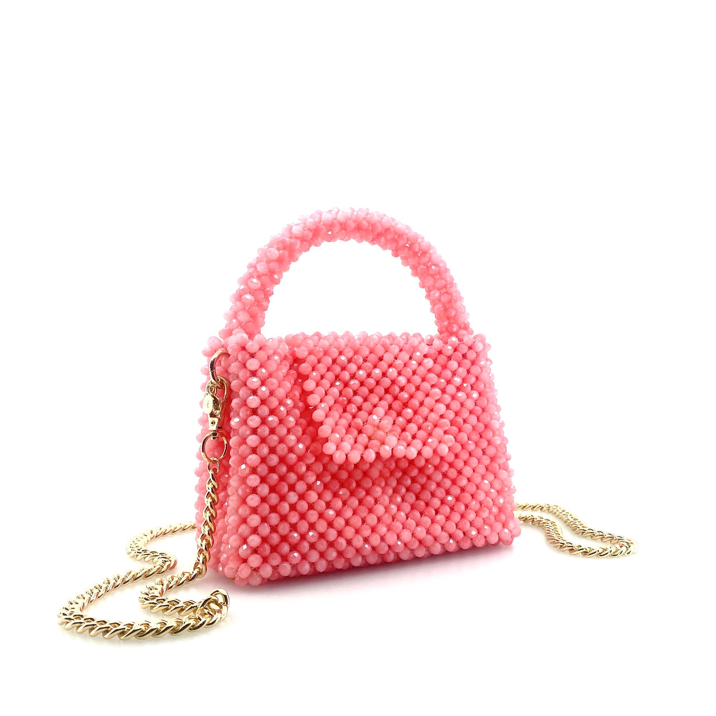 pink beaded handbag with gold chain. on white background