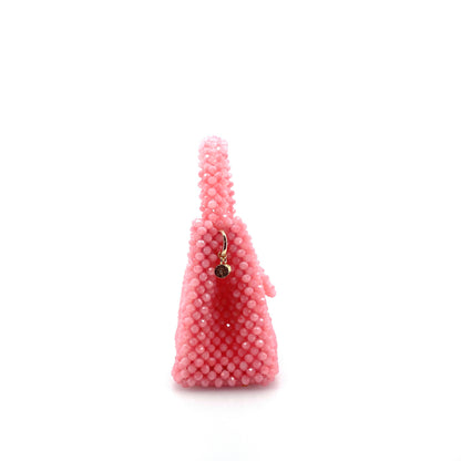 pink beaded handbag. on white background 