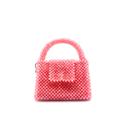 pink beaded handbag. on white background 