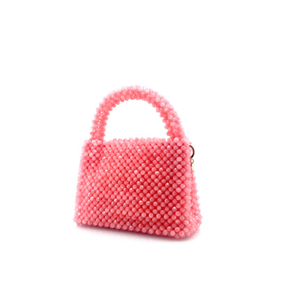 pink beaded handbag. on white background 