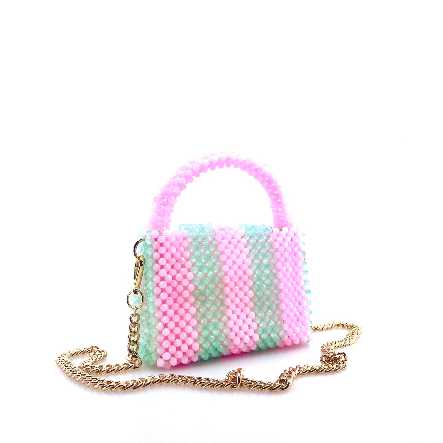 green and pink stripe beaded handbag with gold chain. on white background
