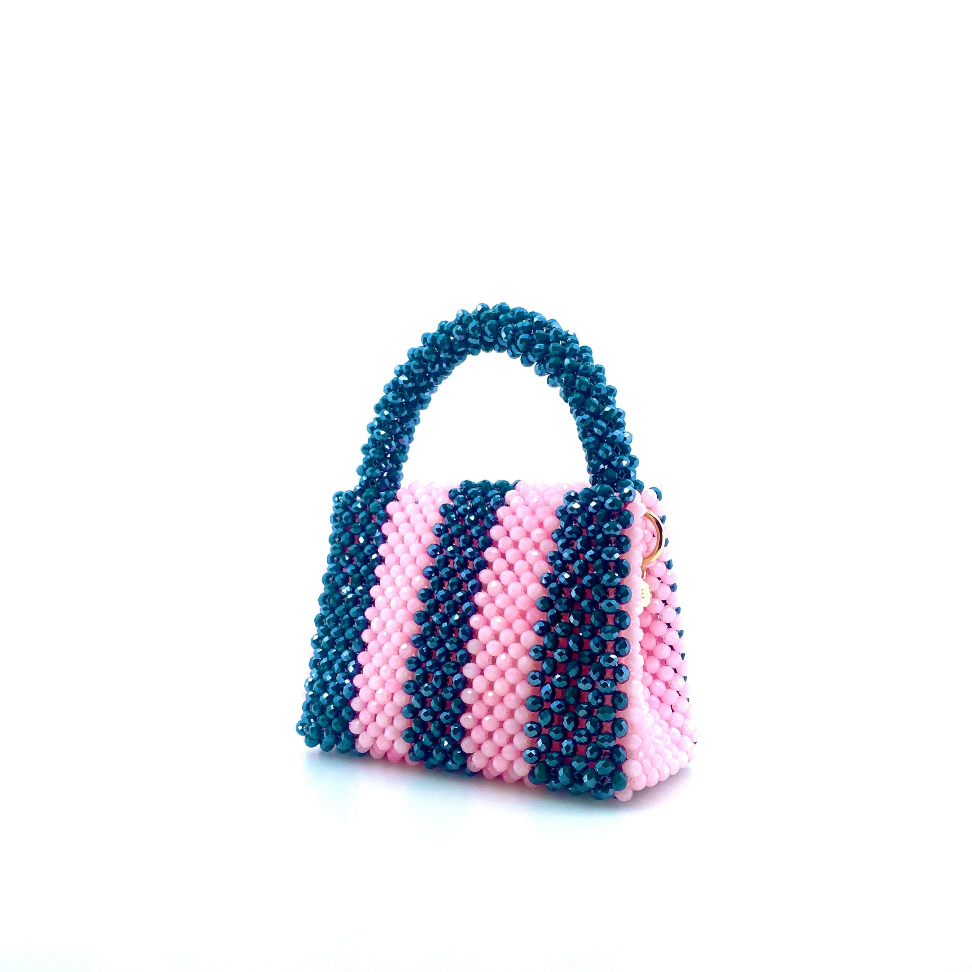 green and pink stripe beaded handbag. on white background