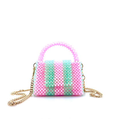 green and pink stripe beaded handbag with gold chain. on white background