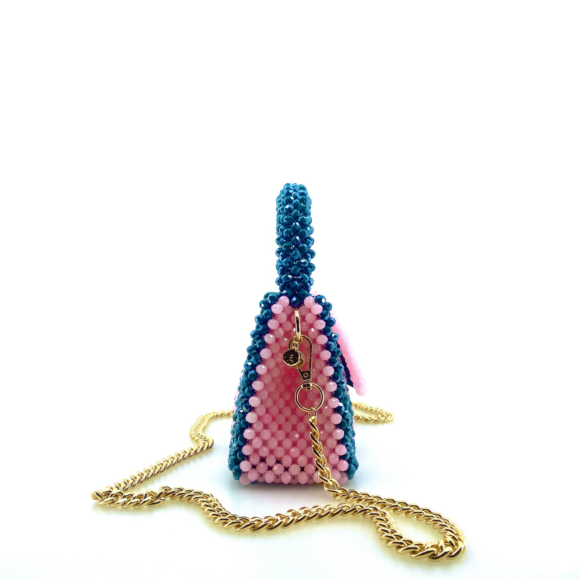 green and pink stripe beaded handbag with gold chain. on white background