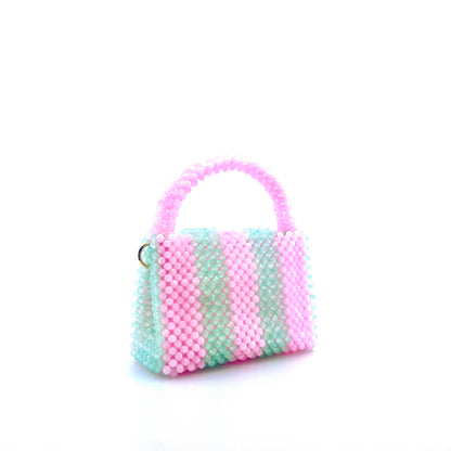 green and pink stripe beaded handbag. on white background