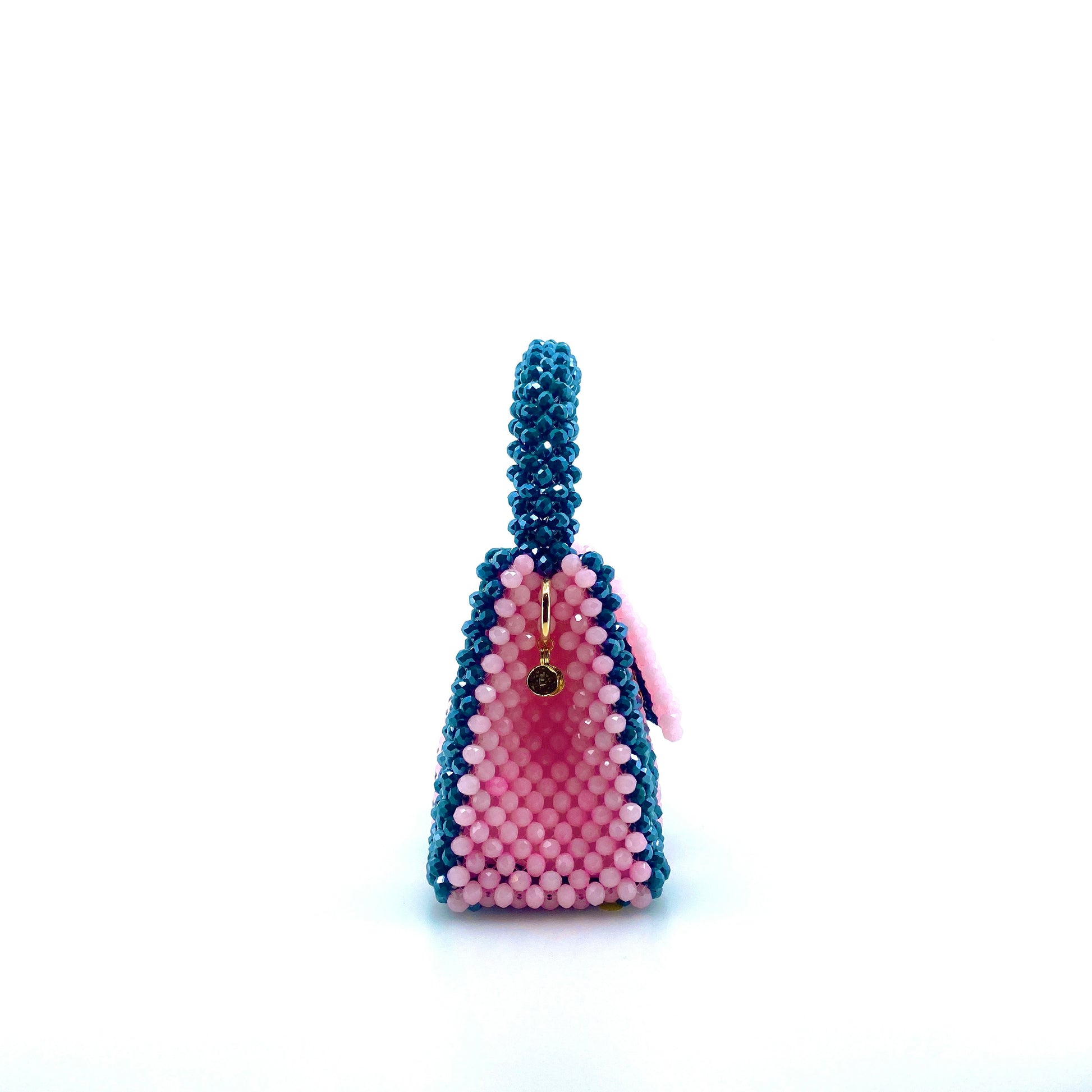 green and pink stripe beaded handbag. on white background