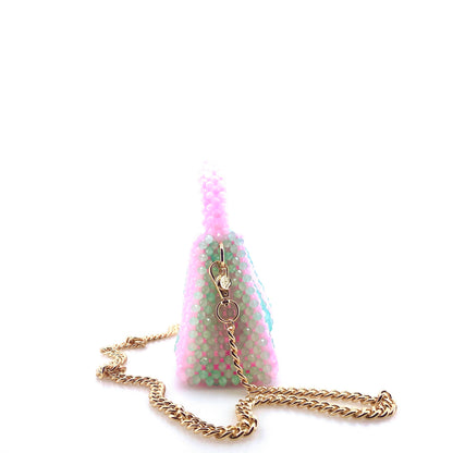 green and pink stripe beaded handbag with gold chain. on white background