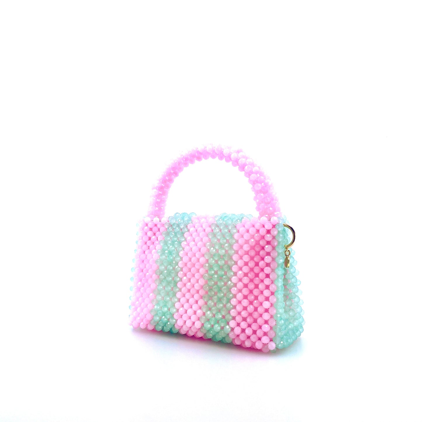 green and pink stripe beaded handbag. on white background