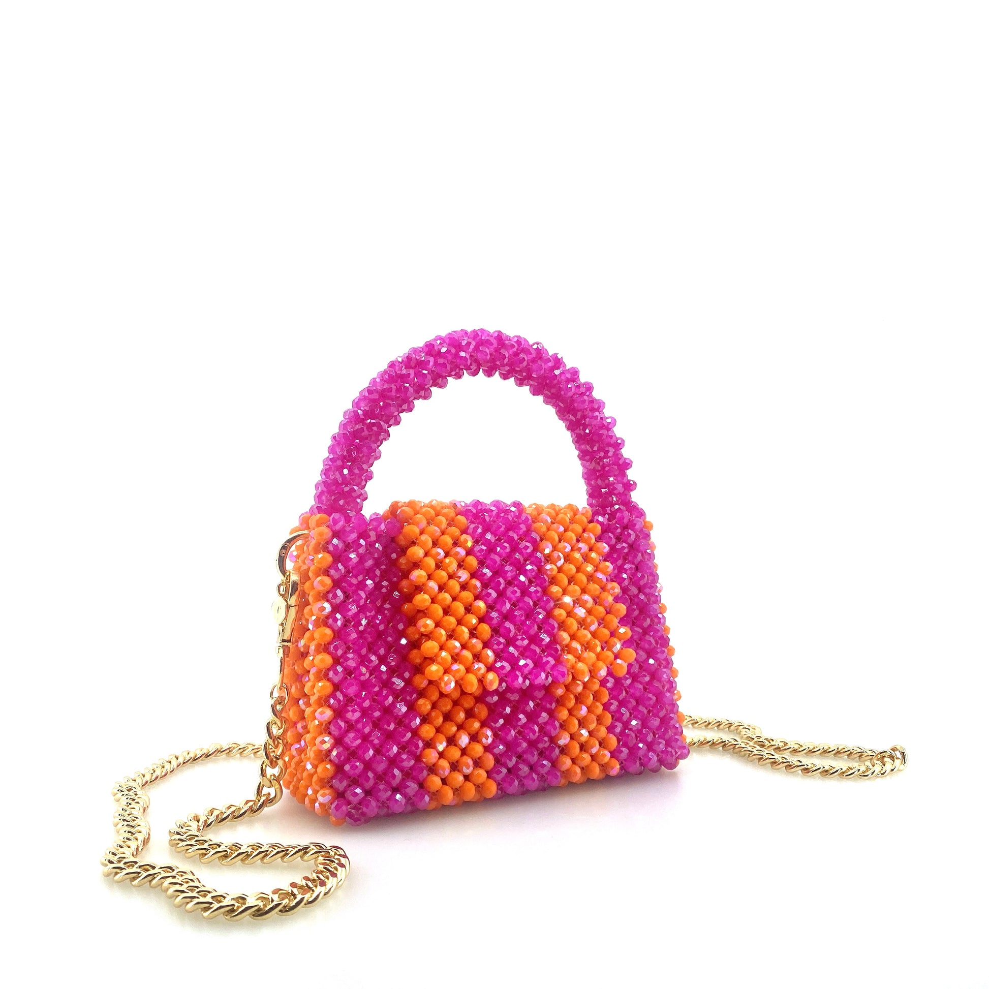 pink and orange stripe beaded handbag with gold chain. on white background