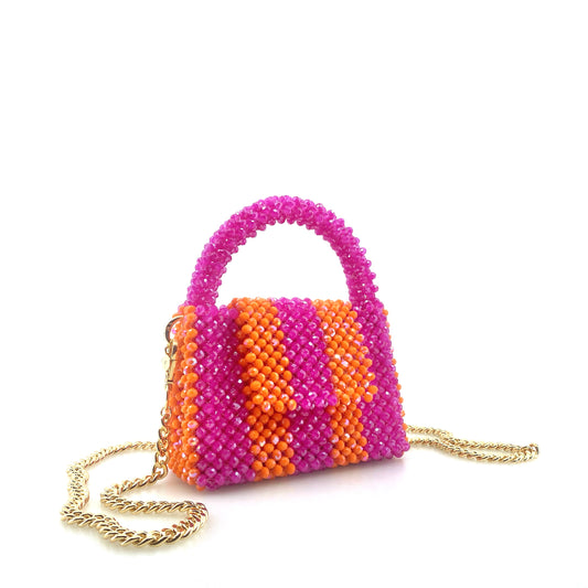 pink and orange stripe beaded handbag with gold chain. on white background