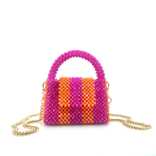 pink and orange stripe beaded handbag with gold chain. on white background
